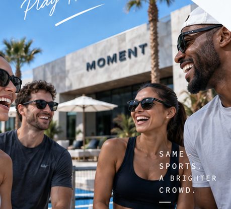 Friends laughing together outside the Moment clubhouse